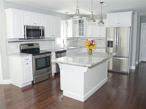 kitchen with stainless steel appliances and white cabinets|white appliances for cabinets.